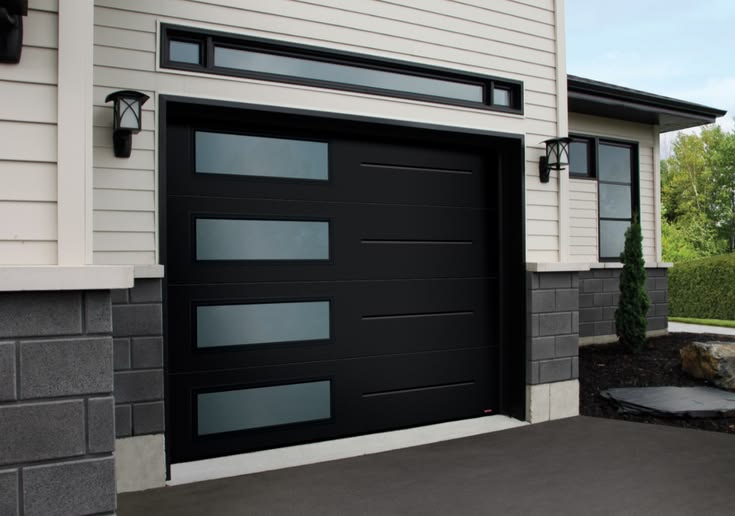 Modern garage door with glass top panel   Koning Garage Doors Solutions