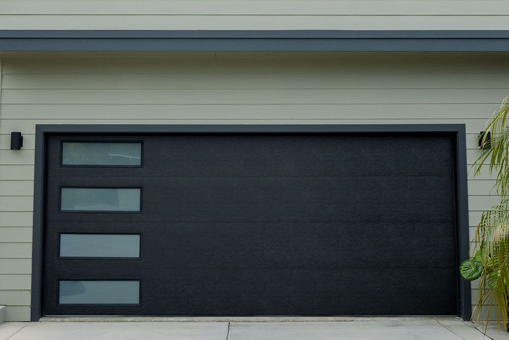 Garage door installation on dark stone facade   West Hollywood, CA